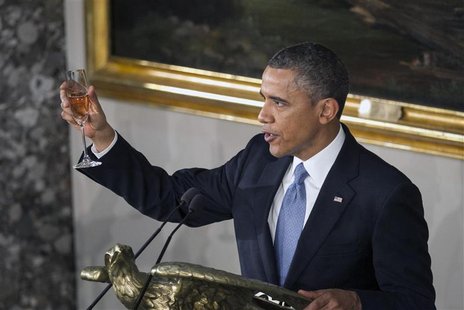 U.S. President Barack Obama raised a glass at the concluded his speech during the Inaugural luncheon in Statuary Hall after his ceremonial s U.S. President Barack Obama raised a glass at the concluded his speech during the Inaugural luncheon in Statuary Hall after his ceremonial s