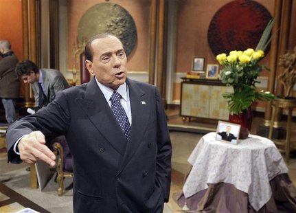 Former Italian Prime Minister Silvio Berlusconi gestures before the taping of the talk show "Telecamere" at Rai television in Rome January 1 Former Italian Prime Minister Silvio Berlusconi gestures before the taping of the talk show "Telecamere" at Rai television in Rome January 1