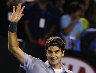Roger Federer of Switzerland celebrates defeating Milos Raonic of Canada in their men's singles match at the Australian Open tennis tourname Roger Federer of Switzerland celebrates defeating Milos Raonic of Canada in their men's singles match at the Australian Open tennis tourname