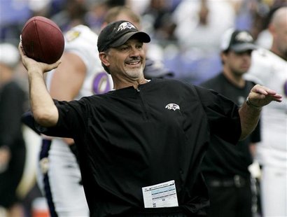 Baltimore Ravens defensive coordinator Chuck Pagano throws a football during practice drills at training camp in Baltimore, Maryland in this Baltimore Ravens defensive coordinator Chuck Pagano throws a football during practice drills at training camp in Baltimore, Maryland in this