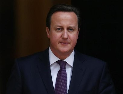 Britain's Prime Minister David Cameron walks out of 10 Downing Street to greet Qatar Emir Hamad bin Khalifa al-Thani in central London, Janu Britain's Prime Minister David Cameron walks out of 10 Downing Street to greet Qatar Emir Hamad bin Khalifa al-Thani in central London, Janu