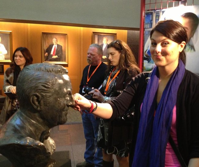 Jess Kelley rubbing Danny Thomas nose for good luck. It is a tradition that has been done for many many years. The nose is even a different color now.