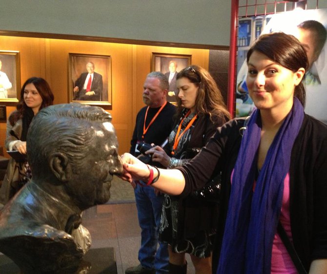 Jess Kelley rubbing Danny Thomas nose for good luck. It is a tradition that has been done for many many years. The nose is even a different color now.