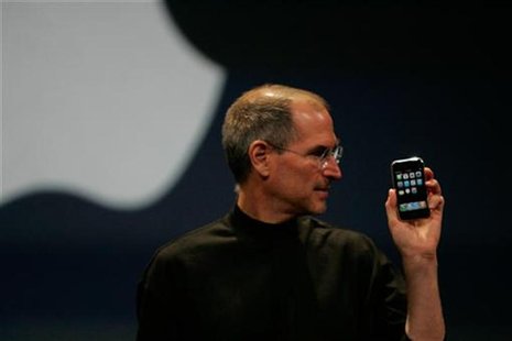 Apple Computer Inc. Chief Executive Officer Steve Jobs holds the new iPhone in San Francisco, California January 9, 2007. REUTERS/Kimberly W Apple Computer Inc. Chief Executive Officer Steve Jobs holds the new iPhone in San Francisco, California January 9, 2007. REUTERS/Kimberly W
