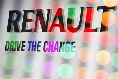French car manufacturer Renault's advertising slogan 'Drive the change' is placed at the company's exhibition stand during the first media d French car manufacturer Renault's advertising slogan 'Drive the change' is placed at the company's exhibition stand during the first media d