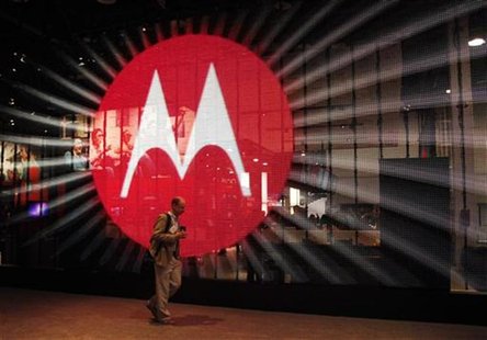 A man walks by a video display at the Motorola booth on the second day of the Consumer Electronics Show (CES) in Las Vegas January 7, 2011. A man walks by a video display at the Motorola booth on the second day of the Consumer Electronics Show (CES) in Las Vegas January 7, 2011.
