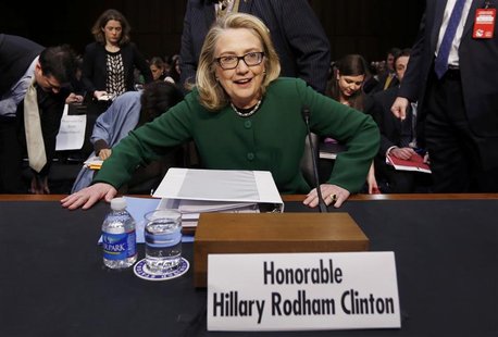 U.S.Secretary of State Hillary Clinton sits down to testify on the September attack on U.S. diplomatic sites in Benghazi, Libya during a hea U.S.Secretary of State Hillary Clinton sits down to testify on the September attack on U.S. diplomatic sites in Benghazi, Libya during a hea