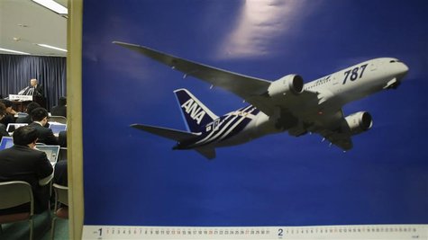 Norihiro Goto, Japan Transport Safety Board chairman, attends a news conference as a calendar displaying a picture of All Nippon Airways' Bo Norihiro Goto, Japan Transport Safety Board chairman, attends a news conference as a calendar displaying a picture of All Nippon Airways' Bo