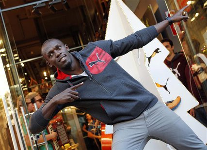 Jamaica's double Olympic champion sprinter Usain Bolt strikes a pose while inaugurating a Puma store in Barcelona November 23, 2012. REUTERS Jamaica's double Olympic champion sprinter Usain Bolt strikes a pose while inaugurating a Puma store in Barcelona November 23, 2012. REUTERS