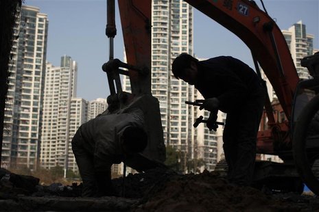 A labourer works at a residential construction site in Shanghai January 18, 2013. REUTERS/Aly Song A labourer works at a residential construction site in Shanghai January 18, 2013. REUTERS/Aly Song