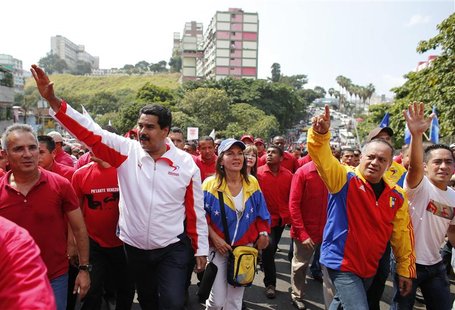 Venezuela's Vice President Nicolas Maduro (L) and Venezuela's National Assembly President Diosdado Cabello (R) greet supporters during a ral Venezuela's Vice President Nicolas Maduro (L) and Venezuela's National Assembly President Diosdado Cabello (R) greet supporters during a ral