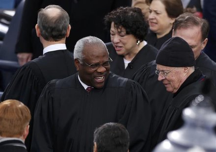 U.S. Supreme Court Justice Clarence Thomas (C) arrives with fellow Court members for inauguration ceremonies on the West front of the U.S. C U.S. Supreme Court Justice Clarence Thomas (C) arrives with fellow Court members for inauguration ceremonies on the West front of the U.S. C