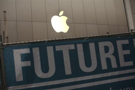 The Apple logo is pictured on the front of the company's flagship retail store near signs for the central subway project in San Francisco, C The Apple logo is pictured on the front of the company's flagship retail store near signs for the central subway project in San Francisco, C