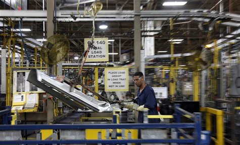 A UAW local 588 assembly worker moves automobile parts around at the Ford Motor Company's Chicago Stamping facility in Chicago Heights, Illi A UAW local 588 assembly worker moves automobile parts around at the Ford Motor Company's Chicago Stamping facility in Chicago Heights, Illi