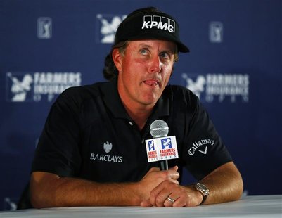U.S. golfer Phil Mickelson chooses his words carefully as he answers questions on taxes during a news conference at the Farmers Insurance Op U.S. golfer Phil Mickelson chooses his words carefully as he answers questions on taxes during a news conference at the Farmers Insurance Op