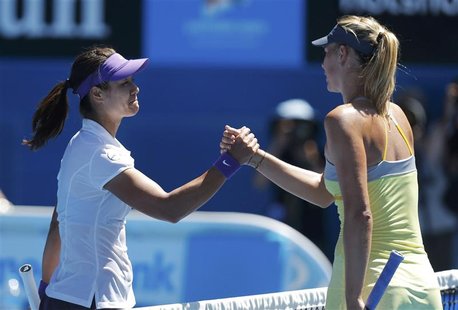 Li Na of China (L) shakes hands with Maria Sharapova of Russia after defeating her in their women's singles semi-final match at the Australi Li Na of China (L) shakes hands with Maria Sharapova of Russia after defeating her in their women's singles semi-final match at the Australi