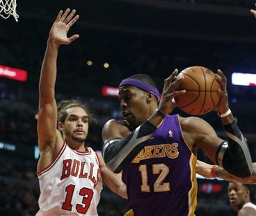 Chicago Bulls center Joakim Noah (13) defends against Los Angeles Lakers center Dwight Howard during the first half of their NBA basketball Chicago Bulls center Joakim Noah (13) defends against Los Angeles Lakers center Dwight Howard during the first half of their NBA basketball