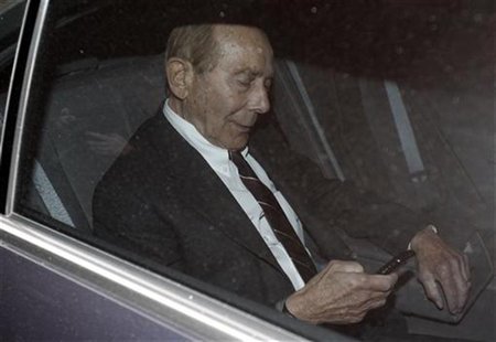 Former CEO of American International Group Inc, Maurice "Hank" Greenberg, checks his phone inside a car after leaving a building in downtown Former CEO of American International Group Inc, Maurice "Hank" Greenberg, checks his phone inside a car after leaving a building in downtown