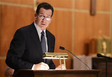 Dannel Malloy, Governor of Connecticut speaks to mourners gathererd inside the St. Rose of Lima Roman Catholic Church at a vigil service for Dannel Malloy, Governor of Connecticut speaks to mourners gathererd inside the St. Rose of Lima Roman Catholic Church at a vigil service for