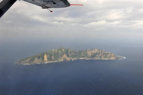 A handout photograph taken on a marine surveillance plane B-3837 shows the disputed islets, known as Senkaku in Japan and Diaoyu in China, D A handout photograph taken on a marine surveillance plane B-3837 shows the disputed islets, known as Senkaku in Japan and Diaoyu in China, D