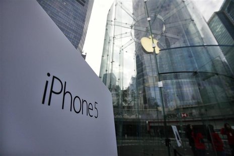 A sign of the new iPhone 5 is seen at the entrance of an Apple Store in the financial district of Pudong in Shanghai December 14, 2012. REUT A sign of the new iPhone 5 is seen at the entrance of an Apple Store in the financial district of Pudong in Shanghai December 14, 2012. REUT