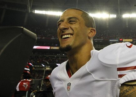 San Francisco 49ers quarterback Colin Kaepernick celebrates after defeating the Atlanta Falcons to win the NFL NFC Championship football gam San Francisco 49ers quarterback Colin Kaepernick celebrates after defeating the Atlanta Falcons to win the NFL NFC Championship football gam
