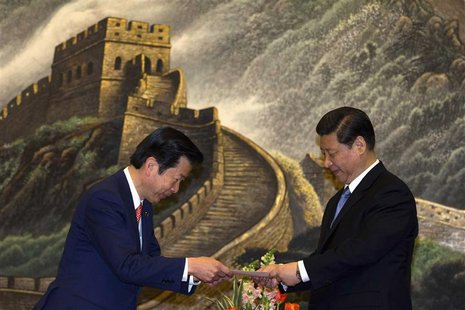 Natsuo Yamaguchi (L), leader of Japan's New Komeito party, delivers a personal letter from Japan's Prime Minister Shinzo Abe to China's pres Natsuo Yamaguchi (L), leader of Japan's New Komeito party, delivers a personal letter from Japan's Prime Minister Shinzo Abe to China's pres
