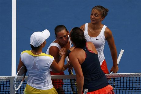 Sara Errani (R) and Roberta Vinci (2nd L) of Italy shake hands with Ashleigh Barty (L) and Casey Dellacqua of Australia after defeating them Sara Errani (R) and Roberta Vinci (2nd L) of Italy shake hands with Ashleigh Barty (L) and Casey Dellacqua of Australia after defeating them