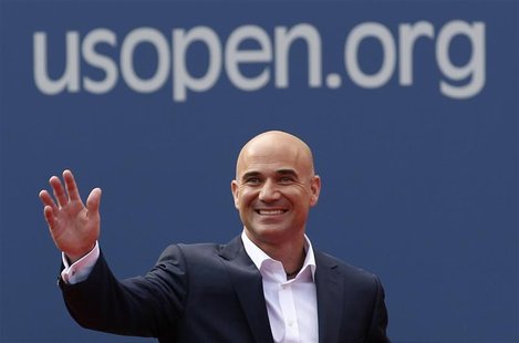 Two-time U.S. Open champion Andre Agassi waves before being inducted into the U.S. Open Court of Champions, which celebrates the legacy of t Two-time U.S. Open champion Andre Agassi waves before being inducted into the U.S. Open Court of Champions, which celebrates the legacy of t