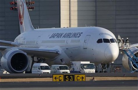 Staff of Japan Airlines' (JAL) enter the company's Boeing Co's 787 Dreamliner plane at New Tokyo international airport in Narita, east of To Staff of Japan Airlines' (JAL) enter the company's Boeing Co's 787 Dreamliner plane at New Tokyo international airport in Narita, east of To