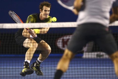 Andy Murray of Britain plays a shot to Roger Federer of Switzerland during their men's singles semi-final match at the Australian Open tenni Andy Murray of Britain plays a shot to Roger Federer of Switzerland during their men's singles semi-final match at the Australian Open tenni