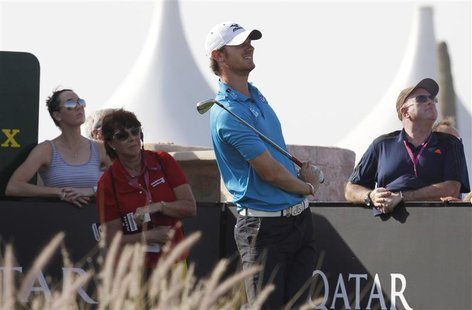 England's Chris Wood watches the ball during the third round of the Commercial Bank Qatar Masters at the Doha Golf Club January 25, 2013. RE England's Chris Wood watches the ball during the third round of the Commercial Bank Qatar Masters at the Doha Golf Club January 25, 2013. RE