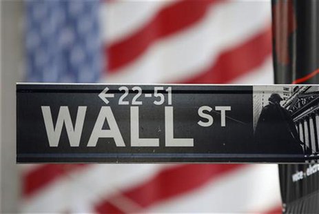 A sign for Wall Street is seen with a giant American flag in the background across from the New York Stock Exchange November 5, 2012. REUTER A sign for Wall Street is seen with a giant American flag in the background across from the New York Stock Exchange November 5, 2012. REUTER