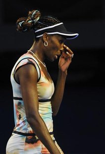 Venus Williams of the U.S. touches her nose during her women's singles match against Maria Sharapova of Russia at the Australian Open tennis Venus Williams of the U.S. touches her nose during her women's singles match against Maria Sharapova of Russia at the Australian Open tennis