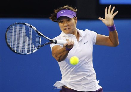 Li Na of China hits a return to Victoria Azarenka of Belarus during their women's singles final match at the Australian Open tennis tourname Li Na of China hits a return to Victoria Azarenka of Belarus during their women's singles final match at the Australian Open tennis tourname