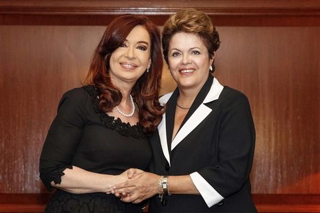 Brazil's President Dilma Rousseff (R) shakes hands with her Argentinean counterpart Cristina Fernandez de Kirchner during a meeting in Santi Brazil's President Dilma Rousseff (R) shakes hands with her Argentinean counterpart Cristina Fernandez de Kirchner during a meeting in Santi