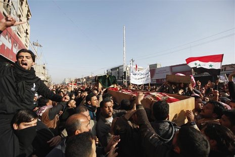 Residents carry a coffin during the funeral of a victim killed in clashes with security forces in Falluja, 50 km (30 miles) west of Baghdad, Residents carry a coffin during the funeral of a victim killed in clashes with security forces in Falluja, 50 km (30 miles) west of Baghdad,