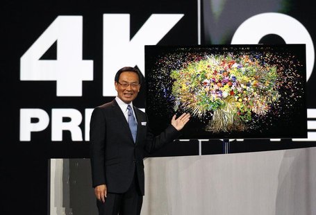 Panasonic chief Kazuhiro Tsuga introduces the company's new 4K OLED 56" television during the Panasonic opening day keynote at the Consumer Panasonic chief Kazuhiro Tsuga introduces the company's new 4K OLED 56" television during the Panasonic opening day keynote at the Consumer