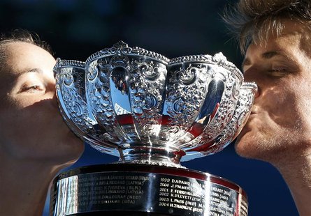 Jarmila Gajdosova and Matthew Ebden (R) of Australia kiss the trophy after defeating Lucie Hradecka and Frantisek Cermak of Czech Republic i Jarmila Gajdosova and Matthew Ebden (R) of Australia kiss the trophy after defeating Lucie Hradecka and Frantisek Cermak of Czech Republic i