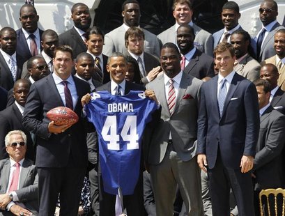 U.S. President Barack Obama (front row, 2nd L) honors the New York Giants NFL team, winners of Super Bowl XLVI, during a ceremony on the Sou U.S. President Barack Obama (front row, 2nd L) honors the New York Giants NFL team, winners of Super Bowl XLVI, during a ceremony on the Sou