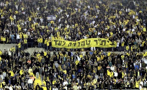 Supporters of Beitar Jerusalem soccer club hold a banner reading "Beitar will always remain pure" during a Premier League match in Jerusalem Supporters of Beitar Jerusalem soccer club hold a banner reading "Beitar will always remain pure" during a Premier League match in Jerusalem