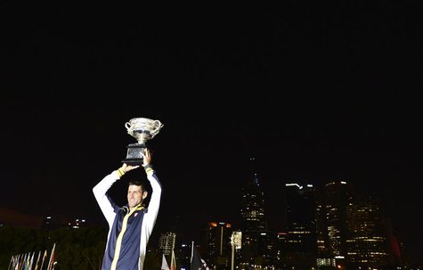 Novak Djokovic of Serbia poses with the Norman Brookes Challenge Cup after defeating Andy Murray of Britain in their men's singles final mat Novak Djokovic of Serbia poses with the Norman Brookes Challenge Cup after defeating Andy Murray of Britain in their men's singles final mat
