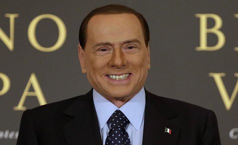 Former Italian Prime Minister Silvio Berlusconi smiles as he arrives to attend the book launch of his friend, TV presenter Bruno Vespa, in R Former Italian Prime Minister Silvio Berlusconi smiles as he arrives to attend the book launch of his friend, TV presenter Bruno Vespa, in R