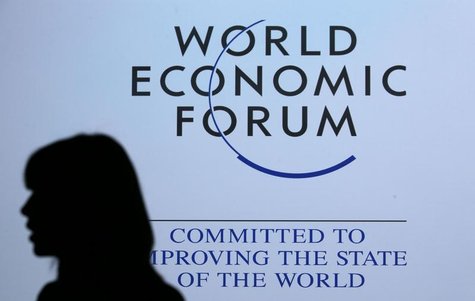 A delegate is silhouetted as she passes by a sign for the annual meeting of the World Economic Forum (WEF) in Davos January 26, 2013. REUTER A delegate is silhouetted as she passes by a sign for the annual meeting of the World Economic Forum (WEF) in Davos January 26, 2013. REUTER
