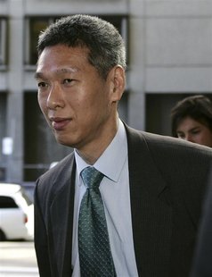 Then SingTel Chief Executive Lee Hsien Yang arrives at the Federal Court in Sydney in this April 5, 2006 file photo. REUTERS/Will Burgess/Fi Then SingTel Chief Executive Lee Hsien Yang arrives at the Federal Court in Sydney in this April 5, 2006 file photo. REUTERS/Will Burgess/Fi