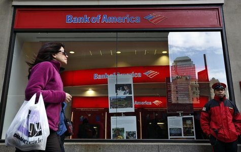 A woman walks past as customers use ATMs at a Bank of America banking center in New York's financial district January 17, 2013. REUTERS/Bren A woman walks past as customers use ATMs at a Bank of America banking center in New York's financial district January 17, 2013. REUTERS/Bren