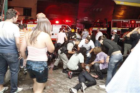A policeman and rescue workers help a man in front of Kiss nightclub in the southern city of Santa Maria, 187 miles (301 km) west of the state capital of Porto Alegre, in this picture taken by Agencia RBS, January 27, 2013.
REUTERS/Germano Roratto/Agencia RBS A policeman and rescue workers help a man in front of Kiss nightclub in the southern city of Santa Maria, 187 miles (301 km) west of the state capital of Porto Alegre, in this picture taken by Agencia RBS, January 27, 2013.
REUTERS/Germano Roratto/Agencia RBS