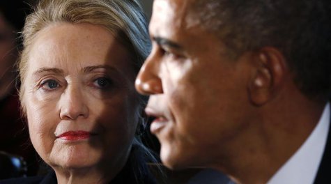 U.S. Secretary of State Hillary Clinton (L) listens to U.S. President Barack Obama speak during a meeting with members of his cabinet at the U.S. Secretary of State Hillary Clinton (L) listens to U.S. President Barack Obama speak during a meeting with members of his cabinet at the