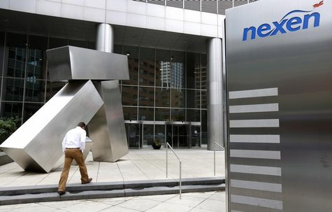 A man walks into the Nexen building in downtown Calgary, Alberta, July 23, 2012. REUTERS/Todd Korol A man walks into the Nexen building in downtown Calgary, Alberta, July 23, 2012. REUTERS/Todd Korol