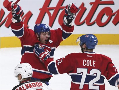 Montreal Canadiens' Andrei Markov (L) celebrates his game-winning goal with teammate Erik Cole (72) during overtime NHL hockey action agains Montreal Canadiens' Andrei Markov (L) celebrates his game-winning goal with teammate Erik Cole (72) during overtime NHL hockey action agains